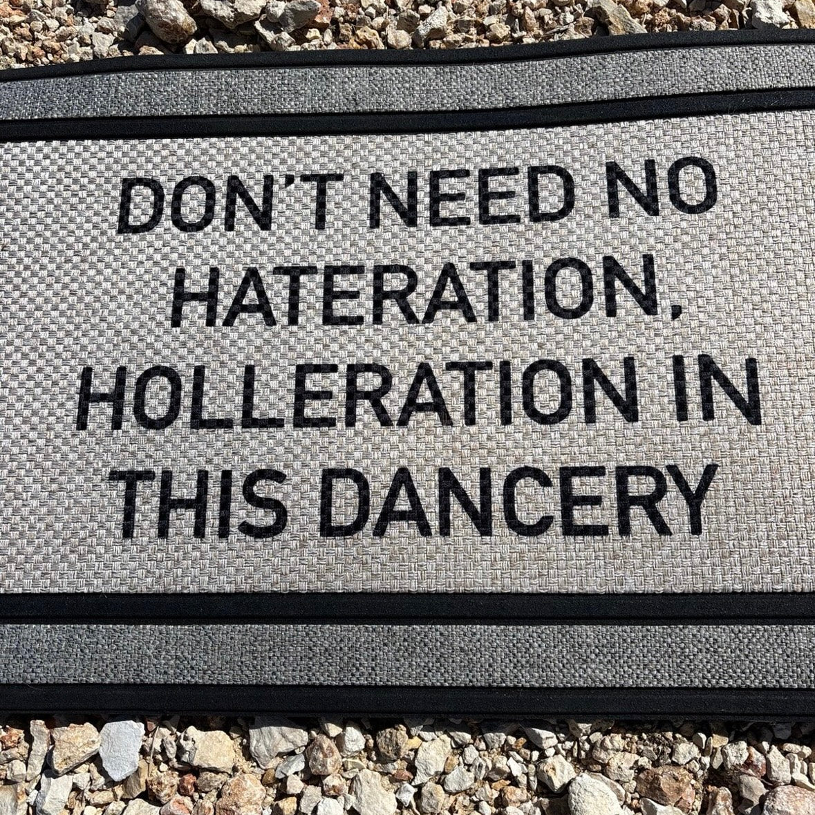 The Doormat District doormat with text 'No Hateration No Holleration In This Dancery' 
