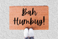 The Doormat District doormat with 'Bah Humbug!' text 