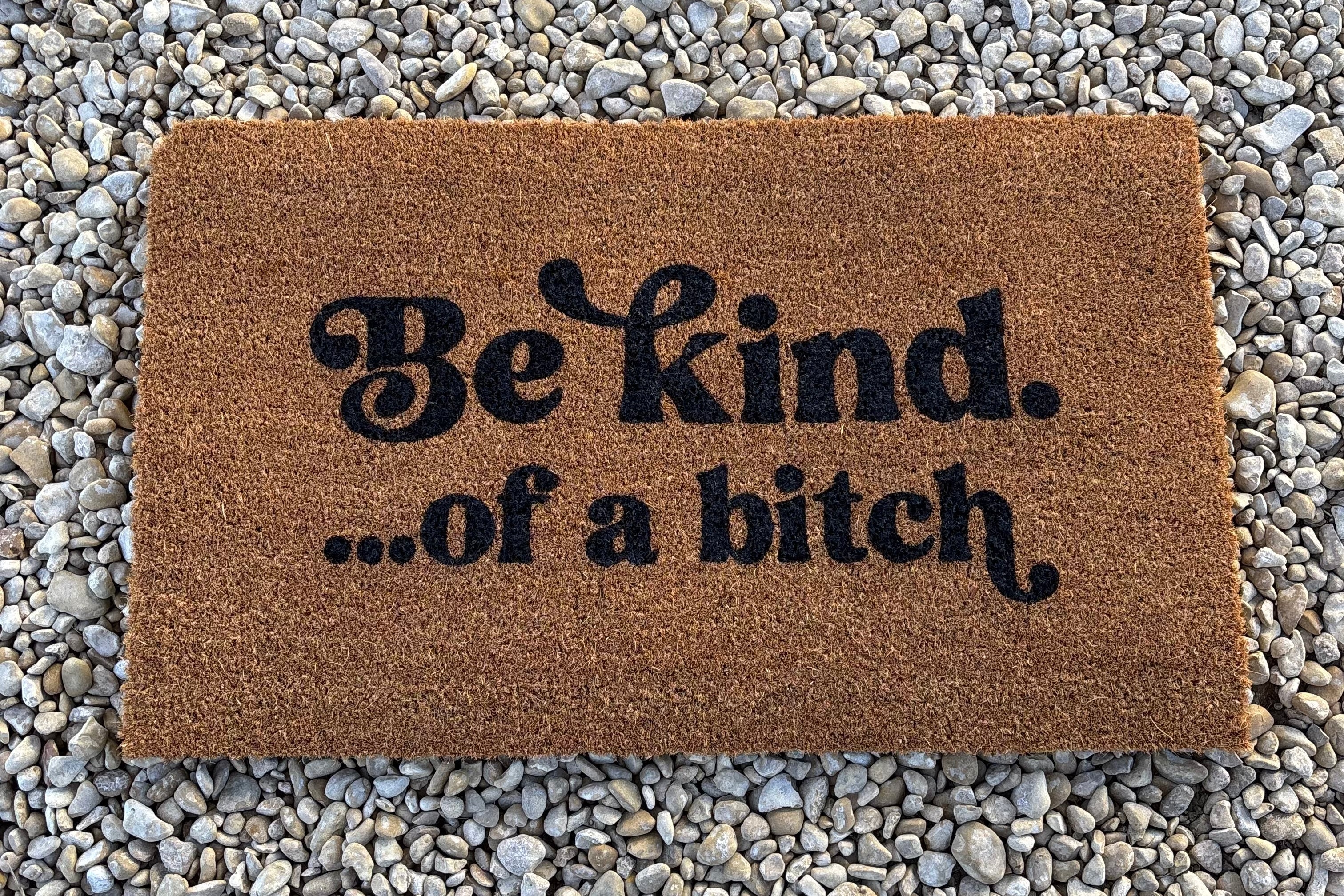 The Doormat District doormat with 'Be kind...of a b*ch' text 