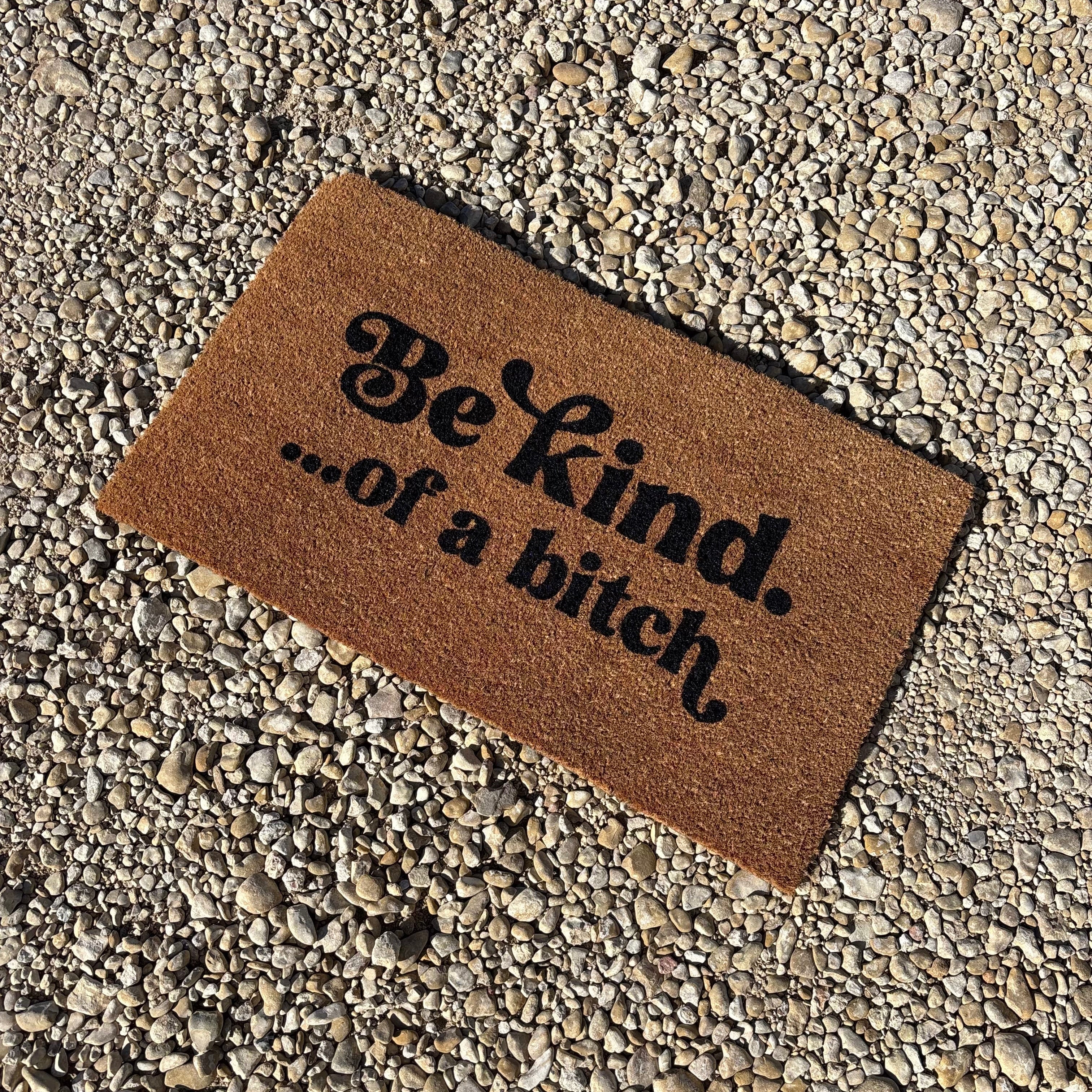 The Doormat District doormat with 'Be kind...of a b*ch' text 