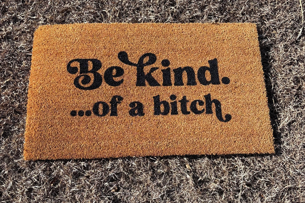 The Doormat District doormat with 'Be kind...of a b*ch' text 