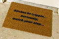 The Doormat District doormat with text "Bitches Be Trippin, Seriously, Watch Your Step"