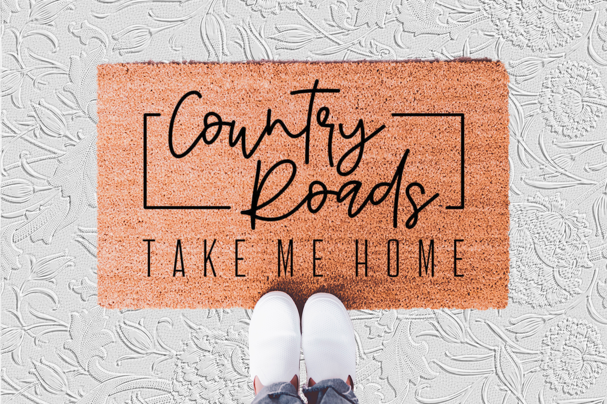The Doormat District doormat with 'Country Roads Take Me Home' text
