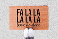 The Doormat District doormat with text "Fa La La La La La Leave Me Alone"