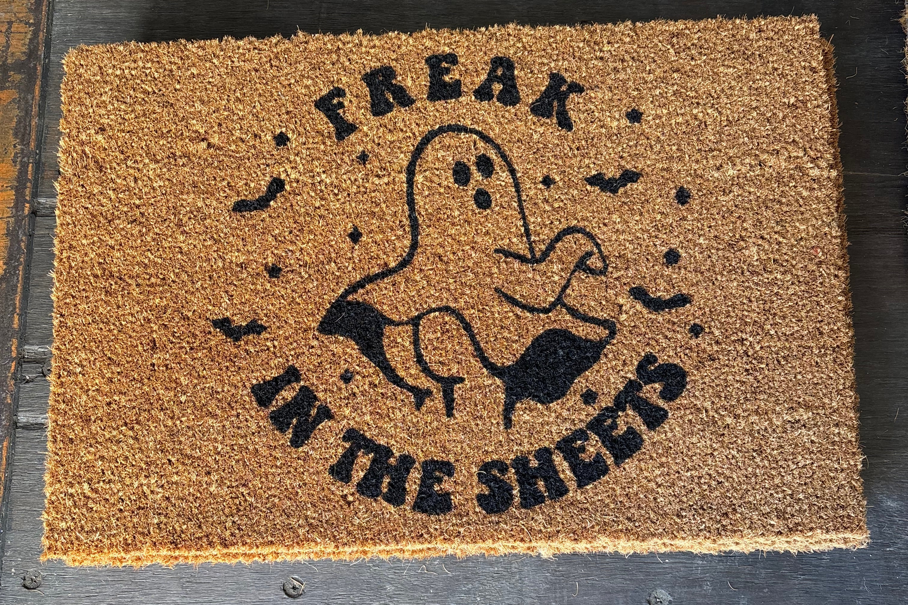 The Doormat District doormat with text 
'Freak In The Sheets' and image of a funny ghost