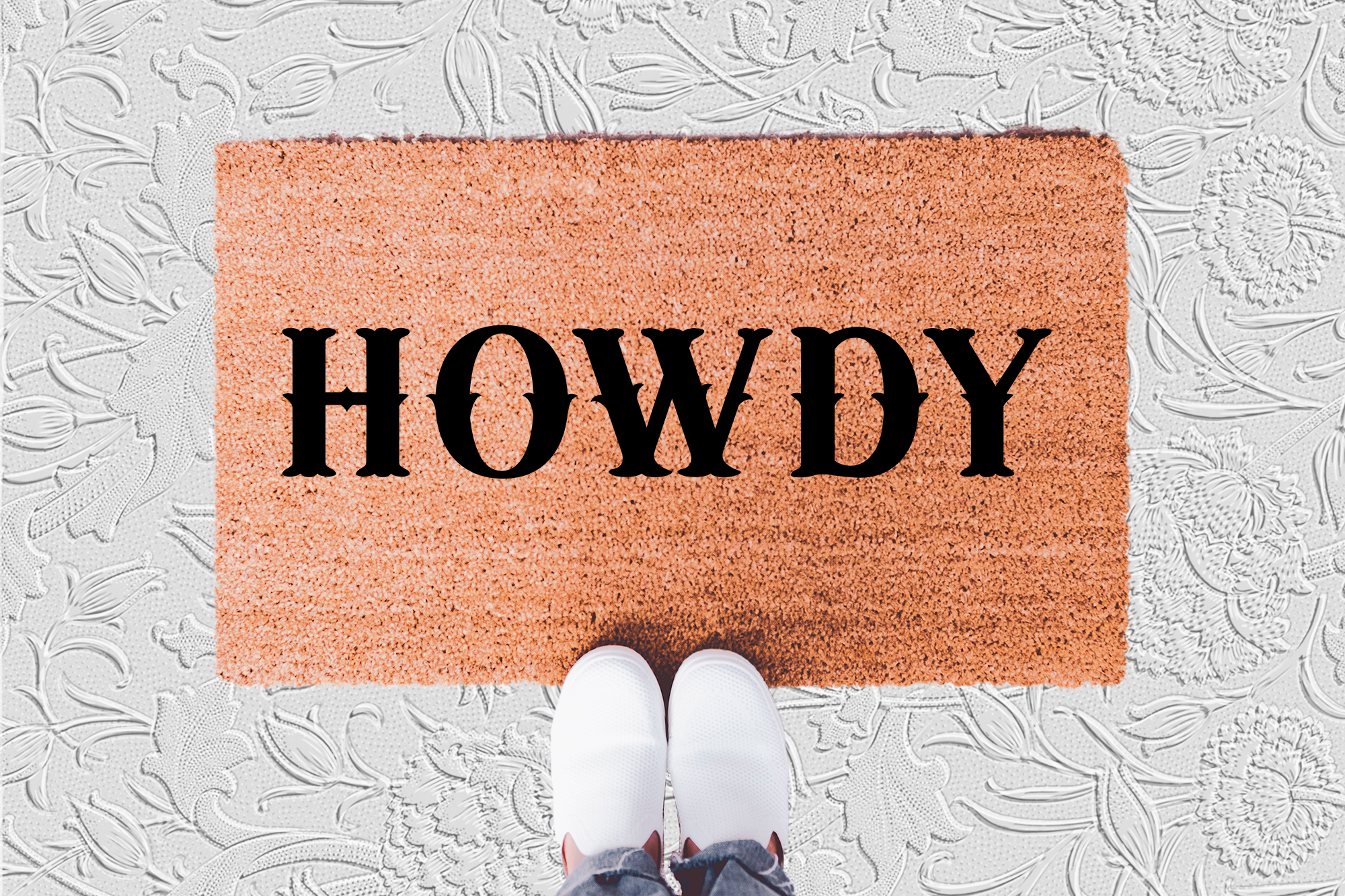 The Doormat District doormat with 'HOWDY' text 