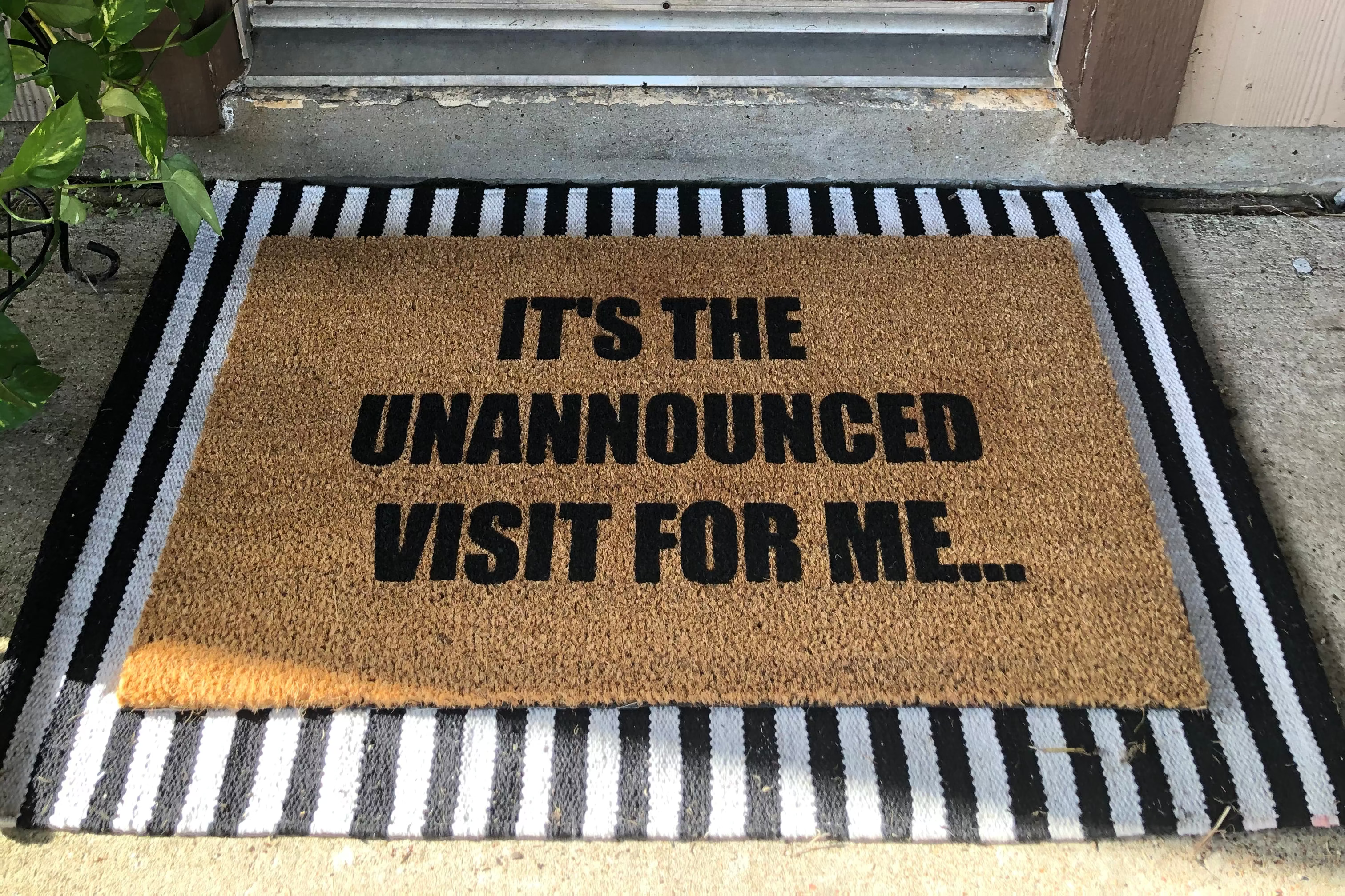 The Doormat District doormat that says "It's The Unannounced Visit For Me"