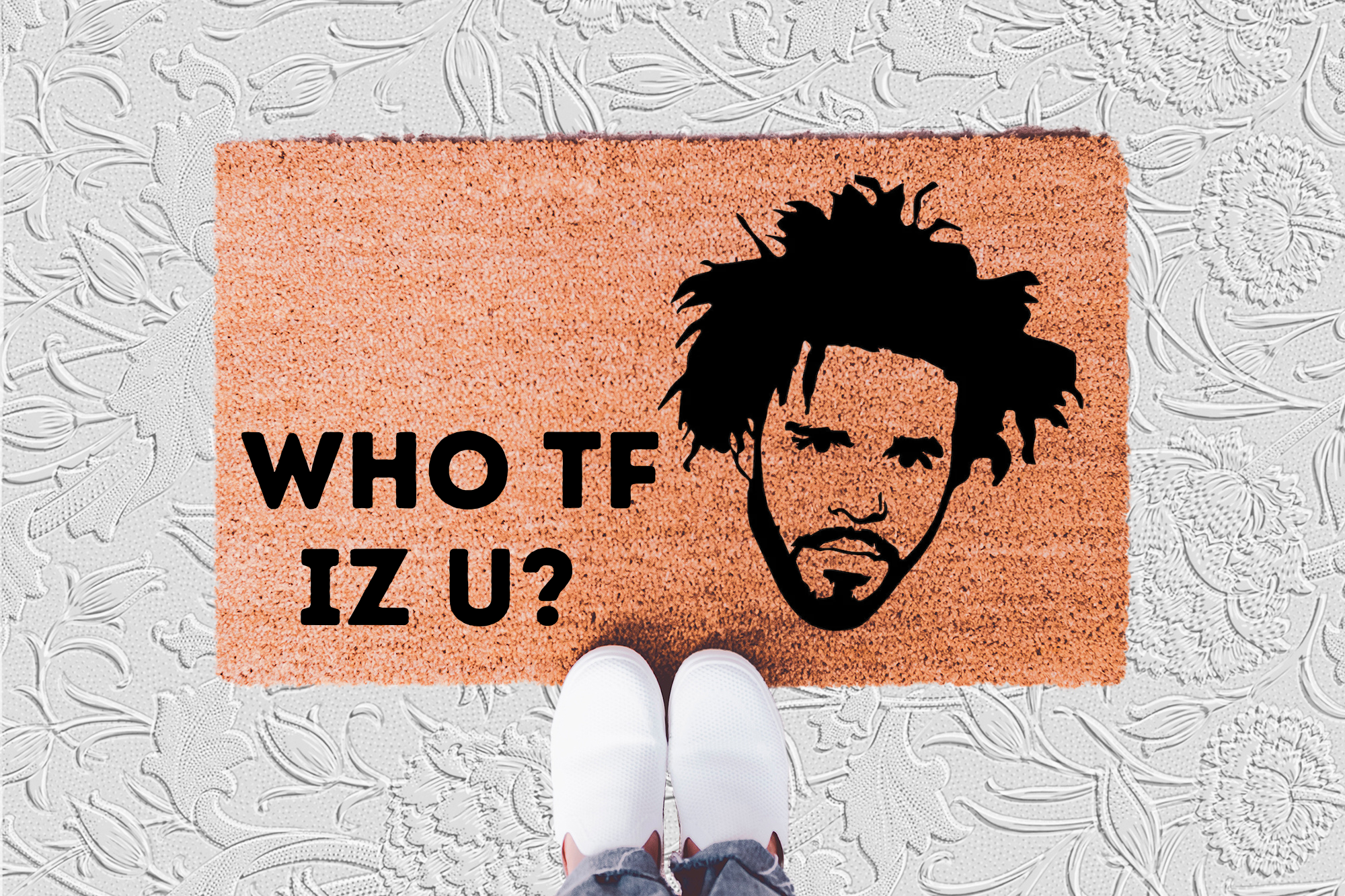The Doormat District doormat with J. Cole's face design and text 'WHO TF IZ U?' 