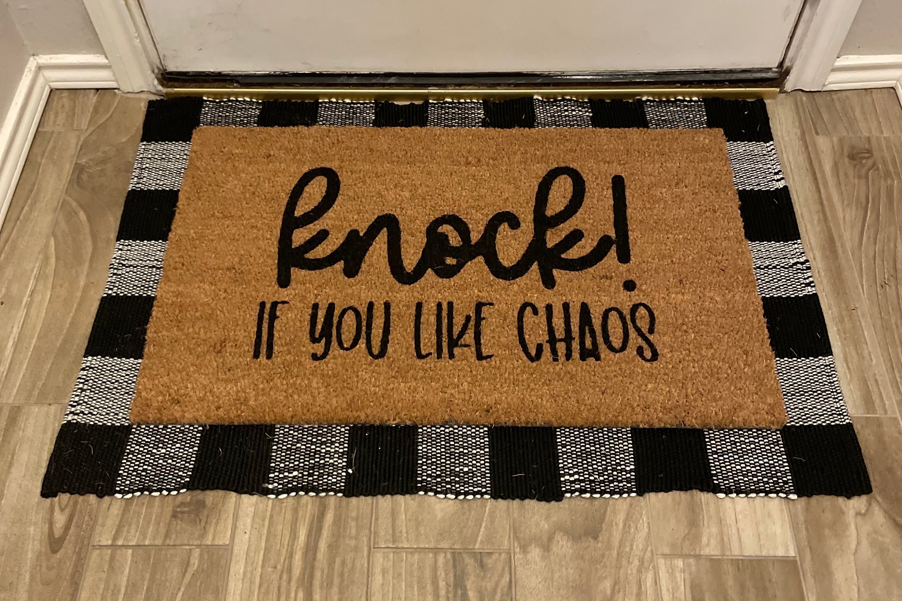 The Doormat District doormat with text "Knock If You Like Chaos"