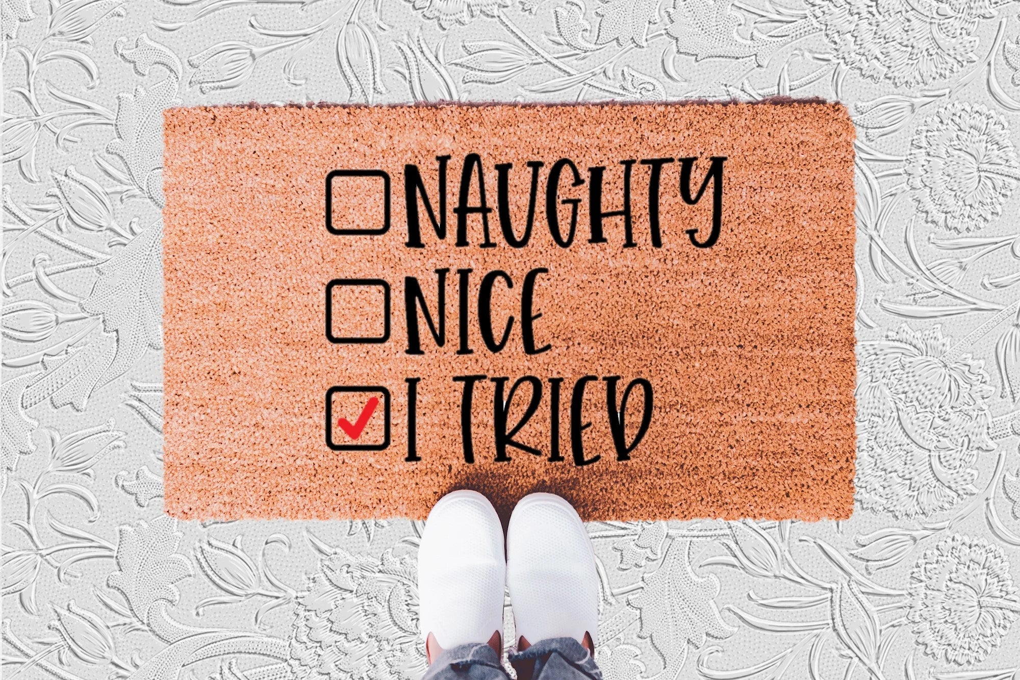 The Doormat District doormat with humorous text 'Naughty, Nice, I Tried' 