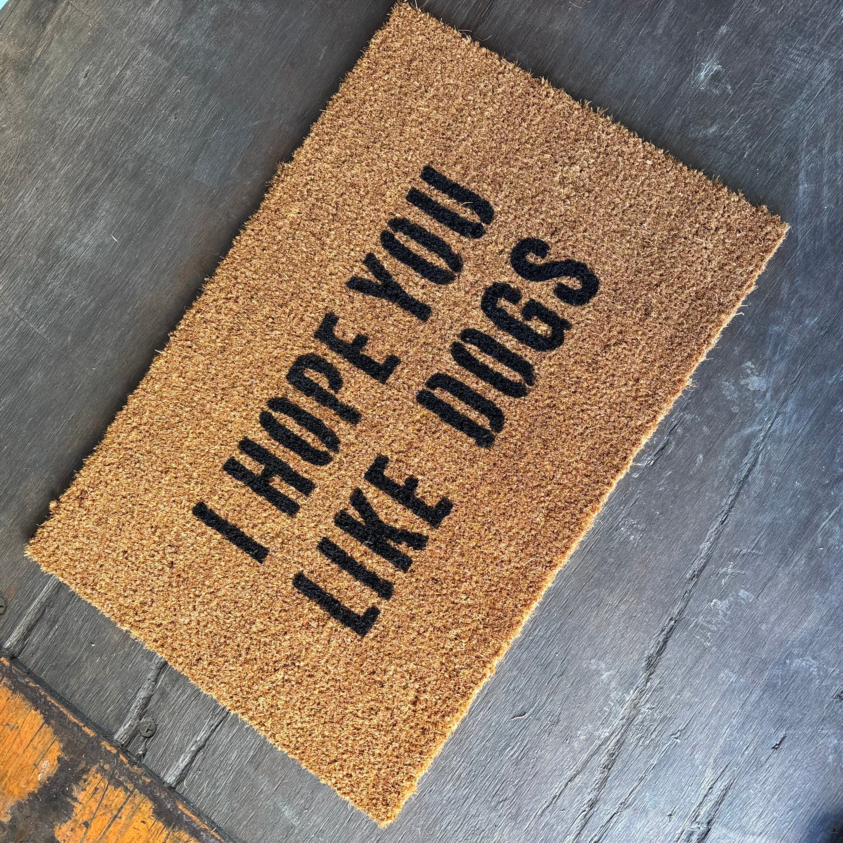 The Doormat District doormat with text 'I hope you like dogs' 
