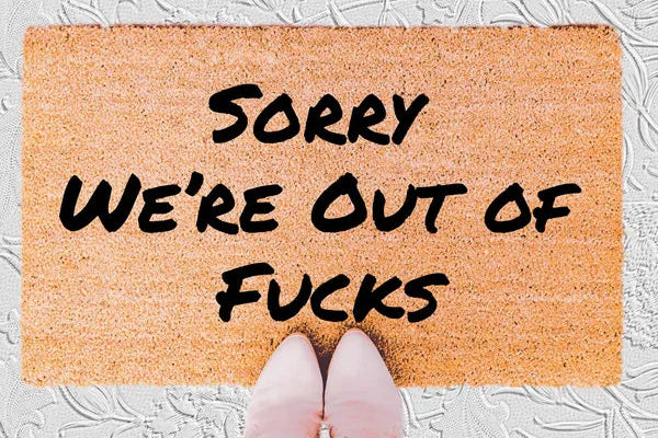 The Doormat District doormat with text 'Sorry We're Out Of Fucks'