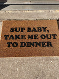 The Doormat District doormat with text "Sup Baby Take Me Out To Dinner"