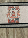The Doormat District doormat text with "There's Some Ho's Ho's Ho's In This House"