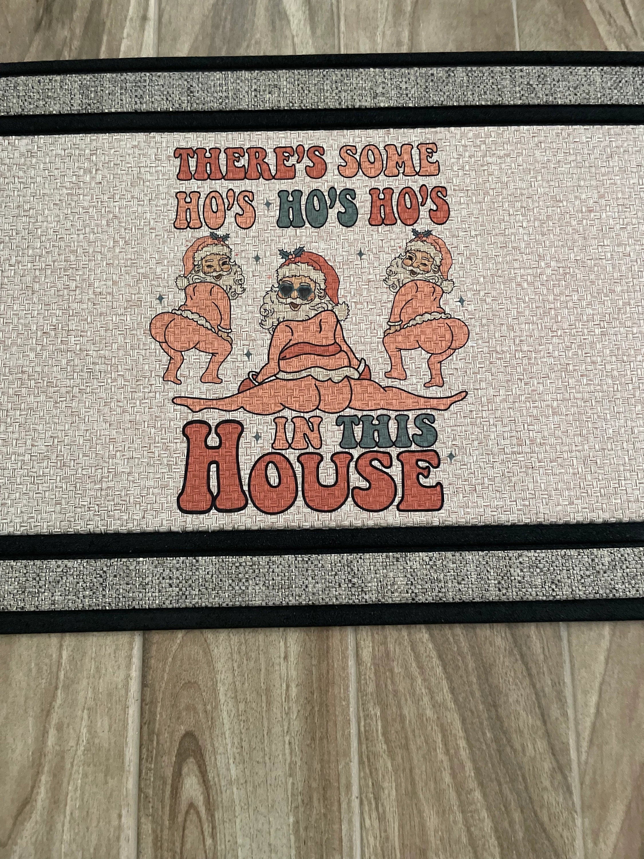 The Doormat District doormat text with "There's Some Ho's Ho's Ho's In This House"