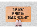 The Doormat District doormat with text 'This home is built on love & profanity'