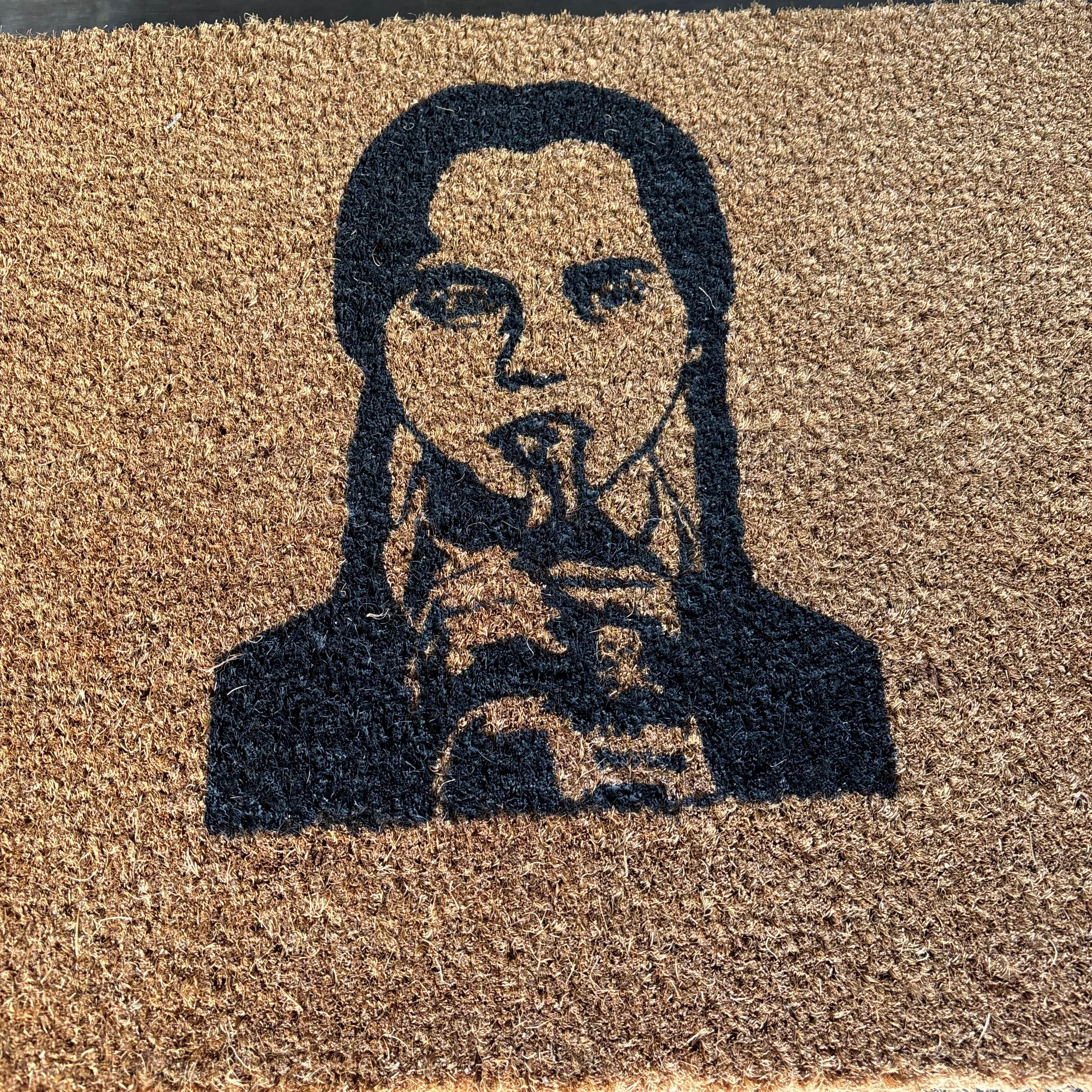 The Doormat District doormat with Wednesday Addams Image