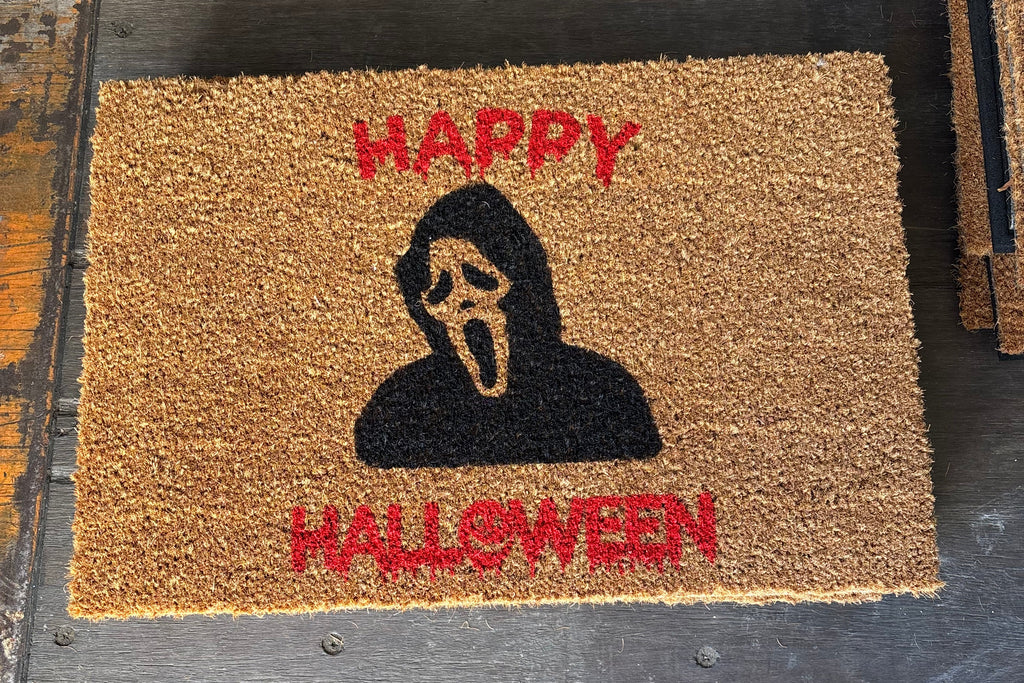 The Doormat District doormat with text 'Happy Halloween' and Ghostface Image