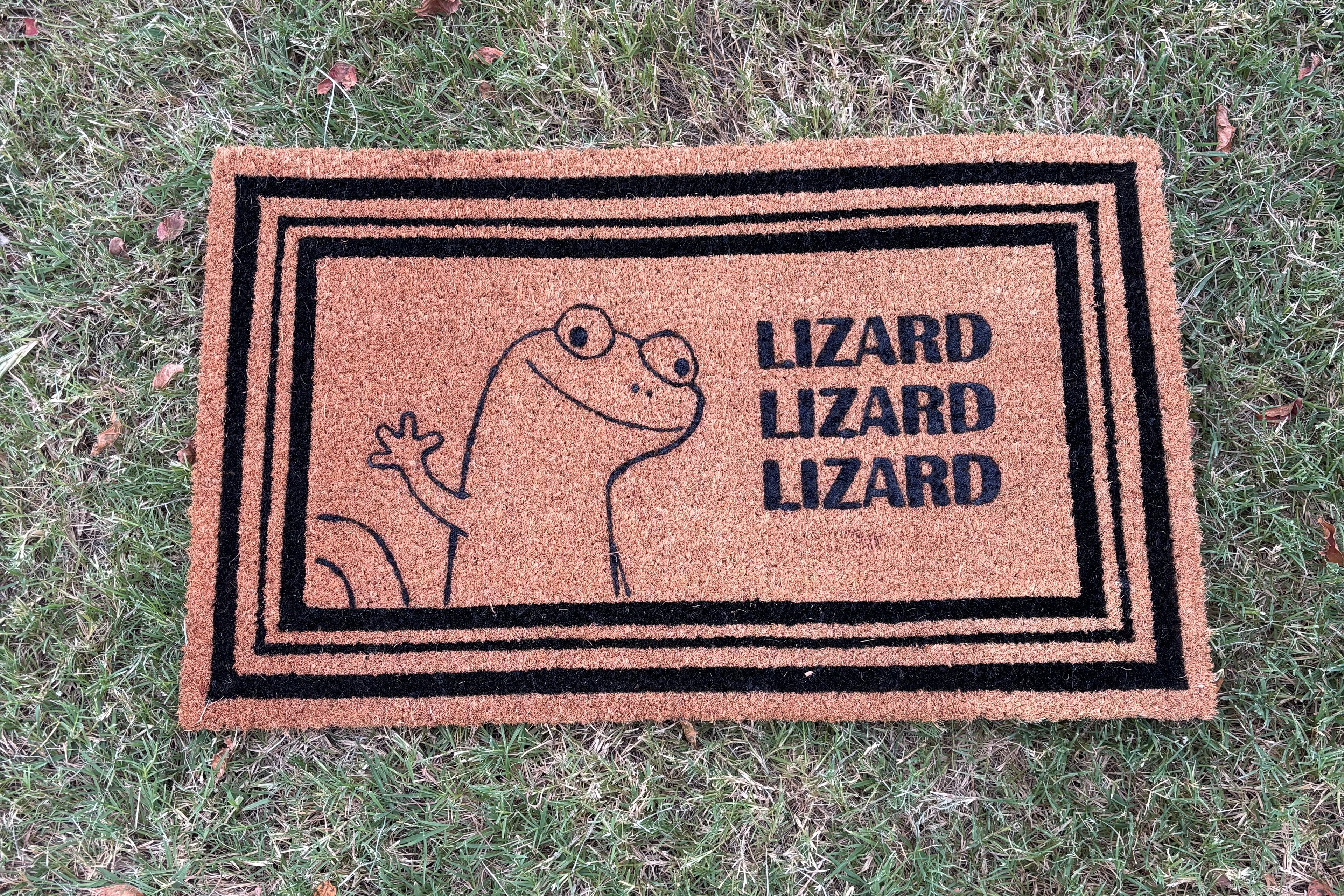 The Doormat District doormat with Lizard image that says "Lizard Lizard Lizard" 