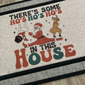The Doormat District doormatwith Christmas-themed text and graphics