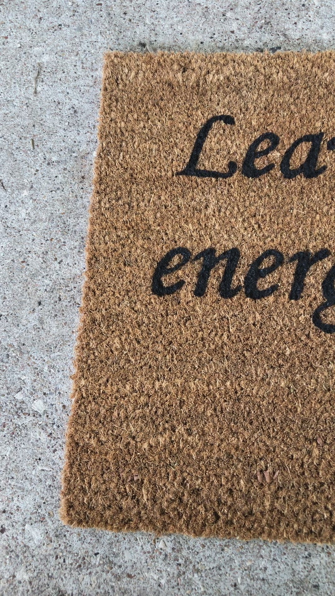 The Doormat District doormat with "Leave The Bad Energy Out Here" Blue Evil Eye